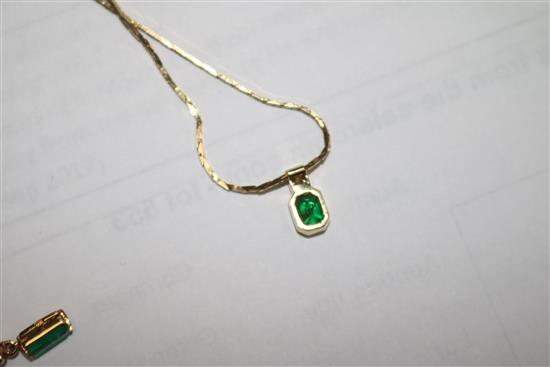 A gold, emerald and diamond pendant on a 14ct gold chain and a pair of similar gold, emerald and diamond ear studs.